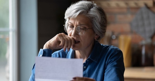 Woman looking at paper